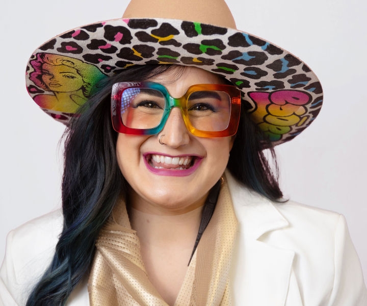 Botox model with quirky hat and glasses